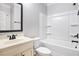 Clean, bright bathroom with a shower-tub combo, white vanity, and modern fixtures at 229 Traditions Drive Southeast Dr, Loganville, GA 30052