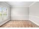 Cozy bedroom featuring neutral carpeting and ample natural light from a window at 229 Traditions Drive Southeast Dr, Loganville, GA 30052