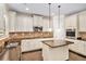 Bright kitchen featuring stainless steel appliances, granite counters, and a center island at 229 Traditions Drive Southeast Dr, Loganville, GA 30052