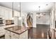 Open-concept kitchen with a view of the staircase and an adjacent dining area at 229 Traditions Drive Southeast Dr, Loganville, GA 30052