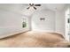Bright main bedroom offering large windows, plush carpet and ample natural light at 229 Traditions Drive Southeast Dr, Loganville, GA 30052