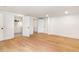 Spacious basement featuring hardwood floors, multiple doors, and an en suite bathroom at 4049 Northlake Creek Cv, Tucker, GA 30084