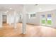 Spacious basement featuring modern lighting, support beams, a window, and double doors to the exterior at 4049 Northlake Creek Cv, Tucker, GA 30084