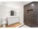 Modern bathroom featuring gray tile surround shower and updated vanity at 4049 Northlake Creek Cv, Tucker, GA 30084