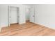 Bright bedroom with hardwood floors, closet and door at 4049 Northlake Creek Cv, Tucker, GA 30084