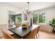 Inviting dining room with stylish seating, natural light, and an open flow, perfect for entertaining at 4049 Northlake Creek Cv, Tucker, GA 30084