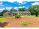 Back exterior view of a home with a brick exterior and green lawn at 4049 Northlake Creek Cv, Tucker, GA 30084