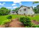 The home features a well-maintained lawn and thoughtful landscaping accentuating the architecture at 4049 Northlake Creek Cv, Tucker, GA 30084