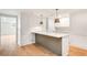 Basement kitchen with an island and bright white cabinets at 4049 Northlake Creek Cv, Tucker, GA 30084