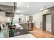 Open-concept kitchen with modern appliances and view into bright living room area at 4049 Northlake Creek Cv, Tucker, GA 30084