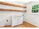 Laundry room featuring wooden beams, new cabinets, and a window at 4049 Northlake Creek Cv, Tucker, GA 30084