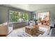 Comfortable living room with stylish decor, hardwood floors, and a great view of the property's surroundings at 4049 Northlake Creek Cv, Tucker, GA 30084