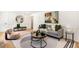 Elegant living room with modern art, stylish furniture, and bright natural light at 4049 Northlake Creek Cv, Tucker, GA 30084