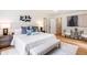 Serene main bedroom with neutral tones, plush bedding, and stylish decor at 4049 Northlake Creek Cv, Tucker, GA 30084