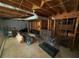 Unfinished basement with exposed wood beams and visible ductwork at 4147 Scofield Pl, Stonecrest, GA 30083