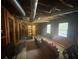 Unfinished basement with wood framing, exposed beams, and exterior access at 4147 Scofield Pl, Stonecrest, GA 30083