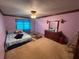 Simple bedroom with carpet and a comfortable bed near a window at 4147 Scofield Pl, Stonecrest, GA 30083