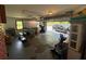 Large garage with overhead lighting, storage, and open garage door with vehicle parked outside at 4147 Scofield Pl, Stonecrest, GA 30083