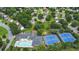 Aerial view showcasing neighborhood amenities, including a pool, tennis courts, and convenient parking at 7325 Brookwood Way, Cumming, GA 30041