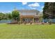 Large backyard with patio area, a pergola, and plenty of green space at 7325 Brookwood Way, Cumming, GA 30041