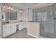 Bright bathroom with tiled shower, double sink vanity, and ample natural light at 7325 Brookwood Way, Cumming, GA 30041
