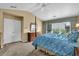 Bedroom featuring a four-poster bed, vaulted ceiling, ceiling fan, and a large window with lots of light at 7325 Brookwood Way, Cumming, GA 30041