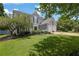 Charming two-story home with a manicured lawn, lush landscaping, and a two-car garage at 7325 Brookwood Way, Cumming, GA 30041