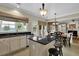Kitchen featuring granite counters, a central island, and an eat-in area connected to the living space at 7325 Brookwood Way, Cumming, GA 30041