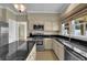 Well-equipped kitchen with stainless steel appliances, dark countertops, and ample cabinet space at 7325 Brookwood Way, Cumming, GA 30041