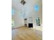 Bright living room with vaulted ceilings, many windows, fireplace and built-in shelving at 10950 Glenhurst, Duluth, GA 30097