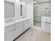 Modern bathroom with double sinks, stone tiled shower, and marble countertops at 366 Blackland Nw Rd, Atlanta, GA 30342