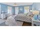 Beautiful bedroom featuring hardwood floors, blue walls, and bright natural light at 366 Blackland Nw Rd, Atlanta, GA 30342