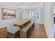 Formal dining room with a chandelier, hardwood floors, and natural light from the glass patio doors at 366 Blackland Nw Rd, Atlanta, GA 30342