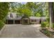 Beautiful home showcasing a manicured lawn, two-car garage, and brick-accented facade at 366 Blackland Nw Rd, Atlanta, GA 30342