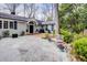 Charming home with a stone patio, lush landscaping, and a welcoming front entrance at 366 Blackland Nw Rd, Atlanta, GA 30342