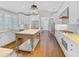 Bright, spacious kitchen featuring custom white cabinets and a center island with seating at 366 Blackland Nw Rd, Atlanta, GA 30342