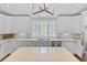 Bright kitchen featuring white cabinets, an island, stainless steel appliances, and natural light from windows at 366 Blackland Nw Rd, Atlanta, GA 30342