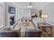 Cozy living room with a fireplace, large windows, comfortable seating, and hardwood floors at 366 Blackland Nw Rd, Atlanta, GA 30342
