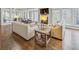 Bright living room with a fireplace, hardwood floors, large windows, and comfortable seating at 366 Blackland Nw Rd, Atlanta, GA 30342