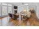 Spacious living room with a fireplace, hardwood floors, large windows, and comfortable seating at 366 Blackland Nw Rd, Atlanta, GA 30342