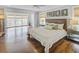 Open main bedroom with a large window offering a nice view and hardwood flooring at 366 Blackland Nw Rd, Atlanta, GA 30342