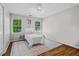 Bright bedroom featuring hardwood floors, a ceiling fan, and lots of natural light at 605 Linkside Hollow, Alpharetta, GA 30005