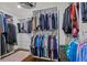 Large walk-in closet with custom shelving and racks for ample storage and organization at 605 Linkside Hollow, Alpharetta, GA 30005