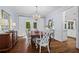 Formal dining room with a chandelier, hardwood floors, and elegant furnishings at 605 Linkside Hollow, Alpharetta, GA 30005