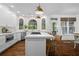 Well-designed kitchen with an island cooktop, stainless appliances, white cabinets, and pendant lighting at 605 Linkside Hollow, Alpharetta, GA 30005