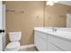 Bathroom features a white sink with cabinets, toilet, and towel racks at 84 Mount Vernon Cir, Atlanta, GA 30338
