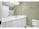 Neutral-colored bathroom with an all-white vanity and mirror at 84 Mount Vernon Cir, Atlanta, GA 30338
