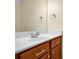 Close-up of a bathroom vanity featuring wood cabinets, a modern sink, and sleek fixtures at 84 Mount Vernon Cir, Atlanta, GA 30338