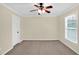 Bedroom with one window, carpet floors, and a ceiling fan at 84 Mount Vernon Cir, Atlanta, GA 30338