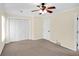 Bedroom with carpet floors, two windows, and a ceiling fan at 84 Mount Vernon Cir, Atlanta, GA 30338